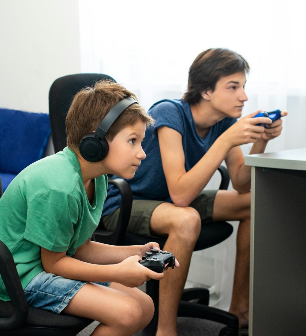 Children playing online games. Internet racing. Playstation. Kids Emotions, stay home